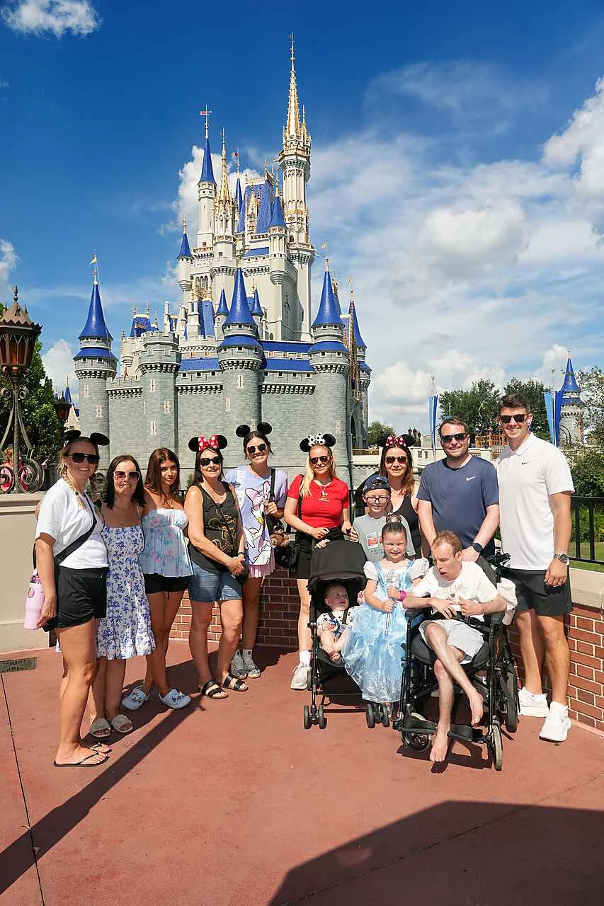 Jodie’s family together in front of Cinderella Castle